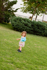 The little girl play in park