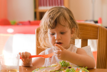 The little girl eating