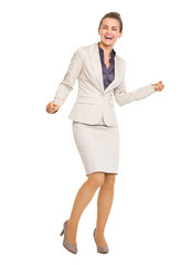 Full length portrait of happy business woman dancing