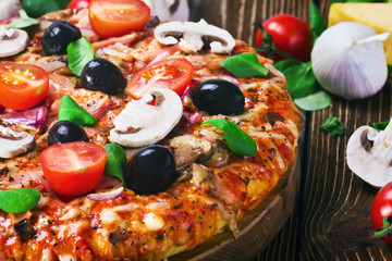 pizza with cheese and mushrooms on the table