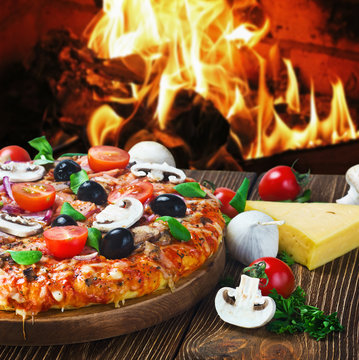 pizza with mushrooms and cheese served on wooden table