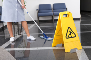 Maid Cleaning The Floor