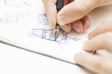 male designer drawing a character