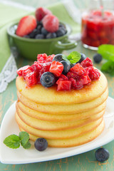 Pancakes with summer berries: strawberries, blueberries.