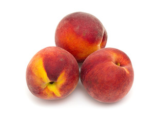 Fototapeta na wymiar three ripe peaches