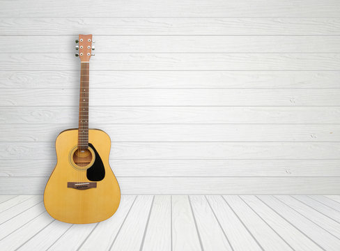 Guitar in white wood room