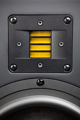 yellow tweeter - high-frequency loudspeaker, closeup