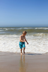 Fototapeta na wymiar Boy having fun at beach