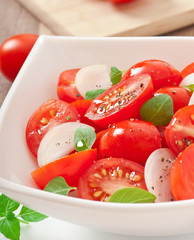 tomato cherry salad with basil, black pepper and onion