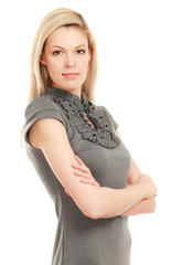 Young woman standing with folded arms