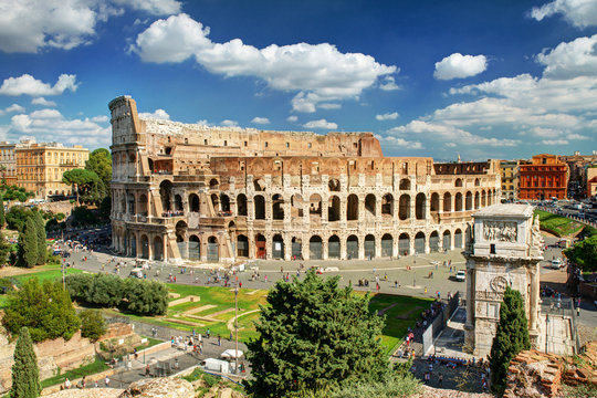Colosseum (Coliseum) in Rome, Italy. Beautiful panorama of Roma city, concept of travel, landscape, skyline.