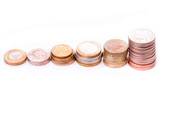 Different old coins stacked isolated