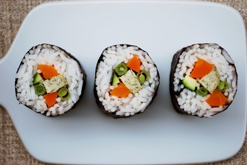 Vegetarian sushi maki rolls with tofu and nori seaweed