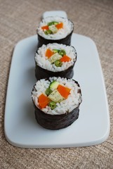 Vegetarian sushi maki rolls with tofu and nori seaweed