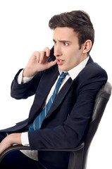 Young businessman yelling on the phone.Upsetting phone talk