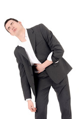 Sad business man having pain, stomach ache.