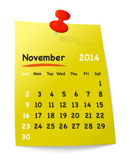 Calendar for november 2014 on yellow sticky note attached with o