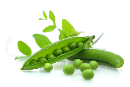 Fresh green peas on white background