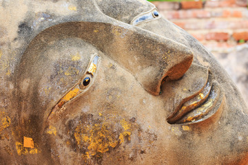 Face of the statue of Buddha at Ayutthaya Thailand.