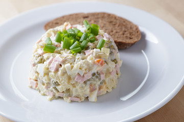 russian salad olivier served with onion