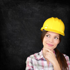 Construction worker woman on chalkboard texture