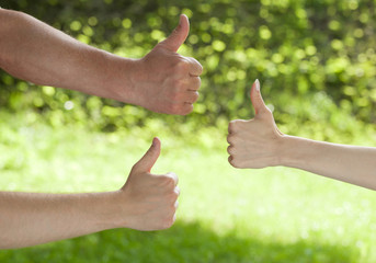 Hands showing thumbs up