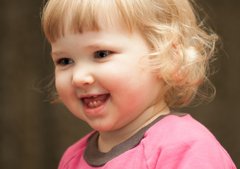 Closeup portrait of happy baby girl