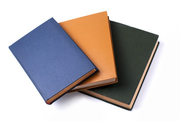 three books for school on white background