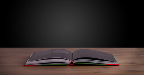Open book on wooden deck