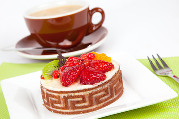 Low-calorie fruit cake with cup caffee, on white background