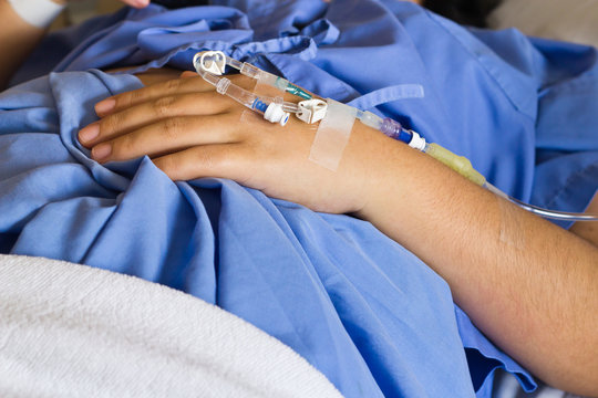 A hand patient with an intravenous drip