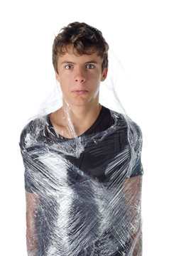 Boy Wrapped In Shrinkwrap Cellophane