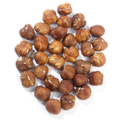 Heap of hazelnuts, isolated on white