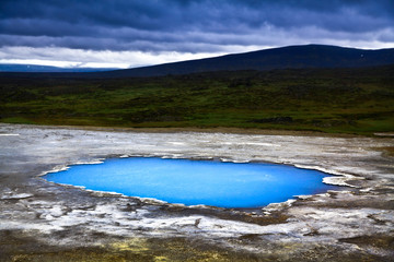 Landscape with hot geothermal spring at night in Iceland