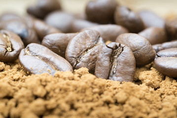 Macro image of ground coffee and coffee beans