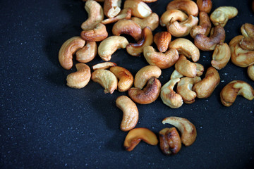 Roasted cashews in the pan.