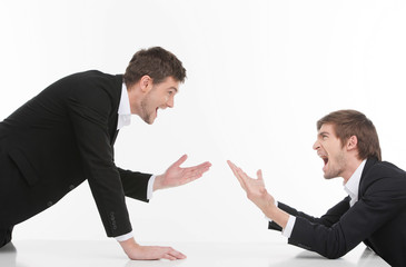 Men confrontation. Two angry young business people shouting and