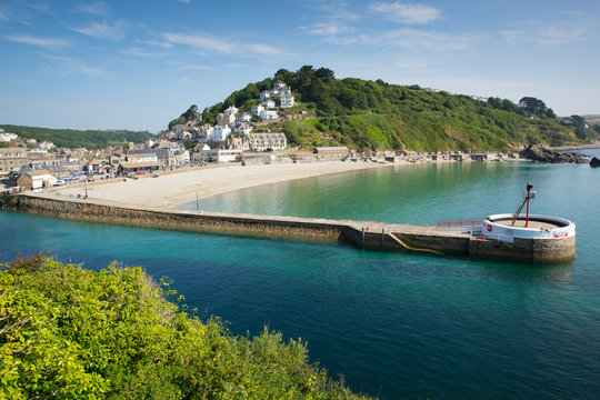 Looe harbour Cornwall England with blue sea and sky