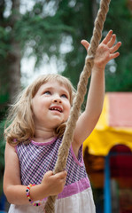 Little girl playing with rope