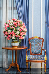Elegance armchair with beautiful flower bouquet