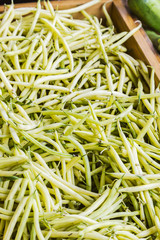 Yellow string beans in wooden crate