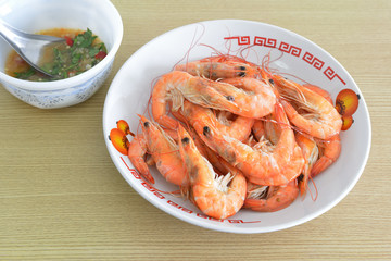 Hot steamed shrimps and seafood sauce