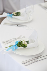 Exotic theme table setting. Decor with fresh rose