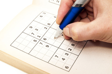 hand making a sudoku