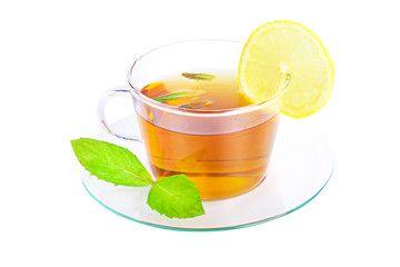 tea in cup with leaf mint and lemon isolated on white