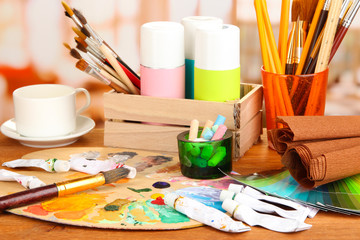 Artistic equipment: paint, brushes and art palette