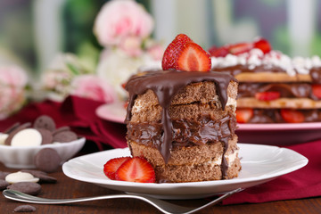 Chocolate cake with strawberry on wooden table close-up