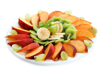 Assortment of sliced fruits on plate, isolated on white