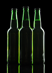 Bottles of beer on black background