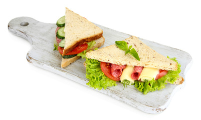 Tasty sandwiches with salami sausage and vegetables